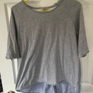 Casual high-low, cropped shirt, with decorative back. Gently worn, size large